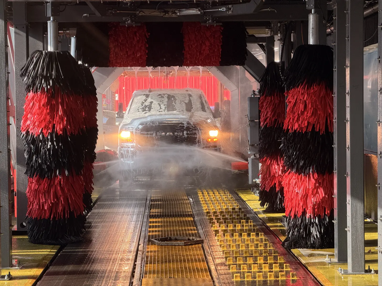 Pickup on the tunnel conveyor, with red and black brushes on either side